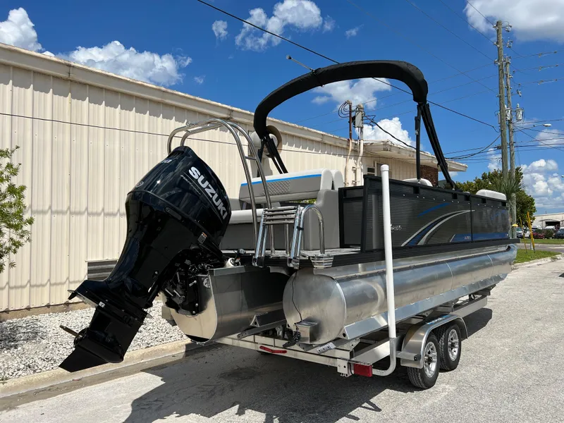 Slide: The Image of 2024 Qwest Splash Pad 822 pontoon boat with Suzuki outboard motor. - 19