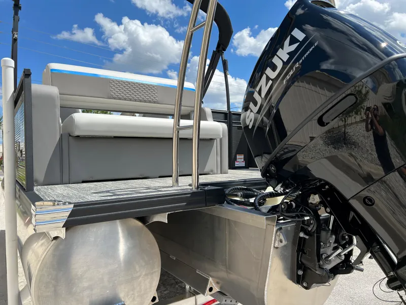 Slide: The Image of 2024 Qwest Splash Pad 822 pontoon boat with Suzuki outboard motor. - 20