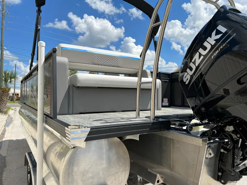 Slide: The Image of 2024 Qwest Splash Pad 822 pontoon boat with Suzuki outboard motor. - 21
