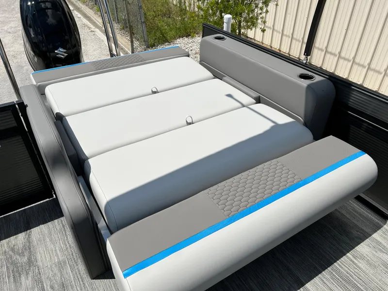 Slide: The Image of 2024 Qwest Splash Pad 822 boat with spacious, cushioned seating area. - 6