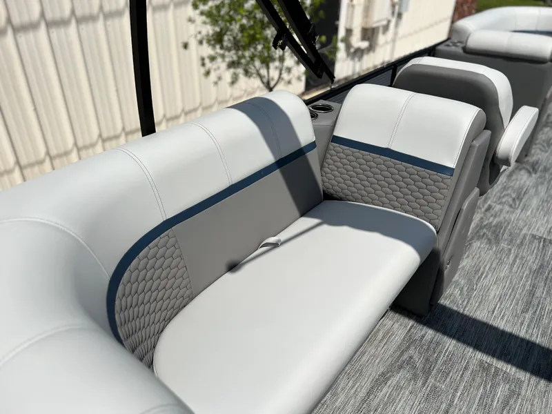 Slide: The Image of 2024 Qwest RLS 820 boat interior with grey and white seating. - 11