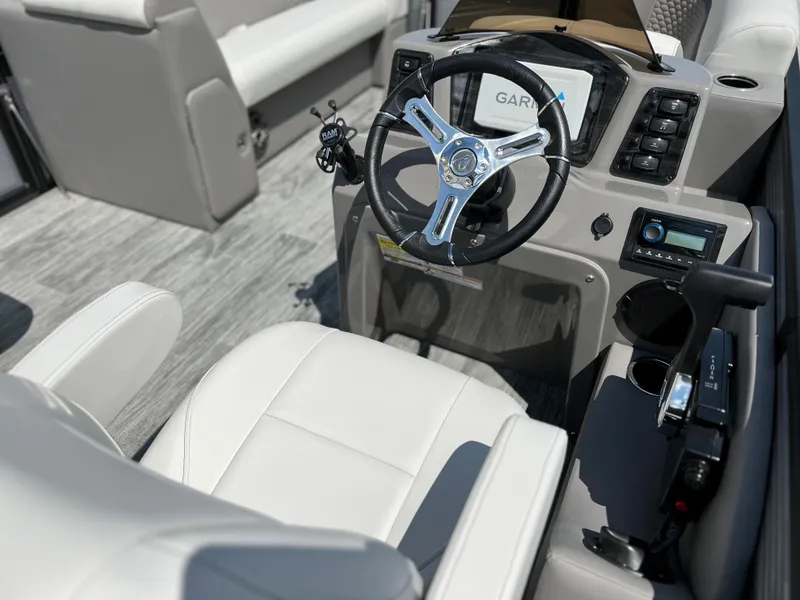 Slide: The Image of 2024 Qwest RLS 820 boat interior with steering wheel and control panel. - 13