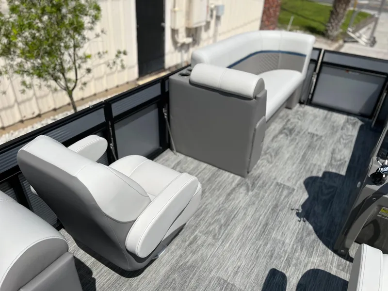 Slide: The Image of 2024 Qwest RLS 820 boat interior with gray seating and flooring. - 14