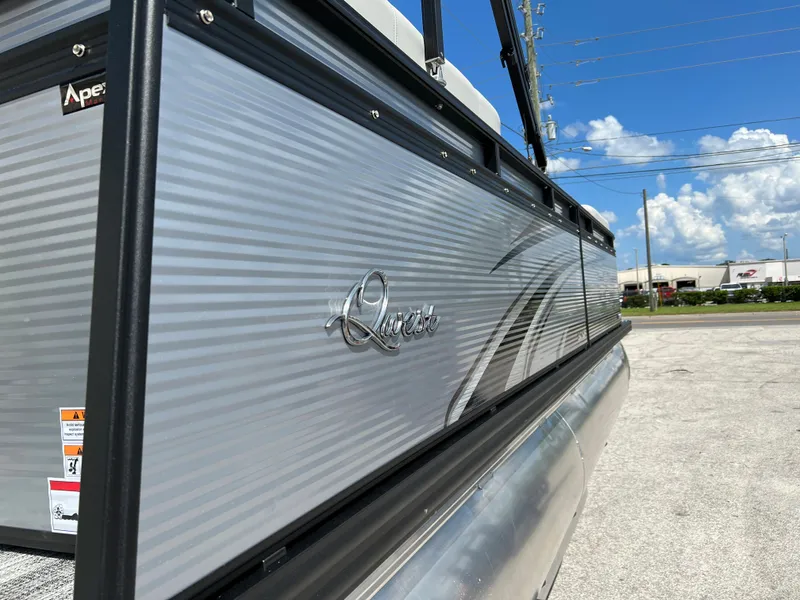 Slide: The Image of 2024 Qwest RLS 820 pontoon boat side view under a clear blue sky. - 3