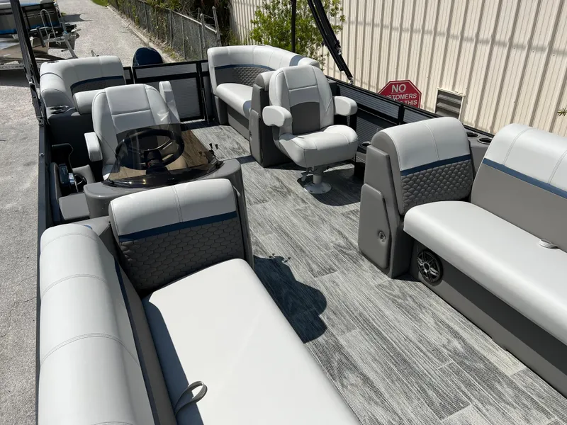 Slide: The Image of 2024 Qwest RLS 820 pontoon boat with spacious seating and modern design. - 5