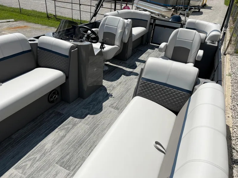 Slide: The Image of 2024 Qwest RLS 820 pontoon boat interior with gray and white seating. - 7
