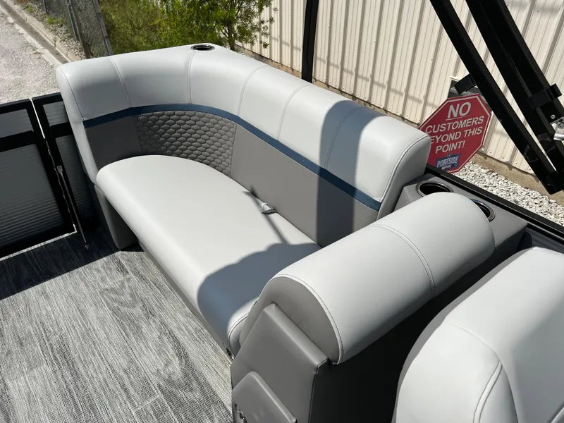 Slide: The Image of 2024 Qwest RLS 820 boat interior with gray seating and blue accents. - 9