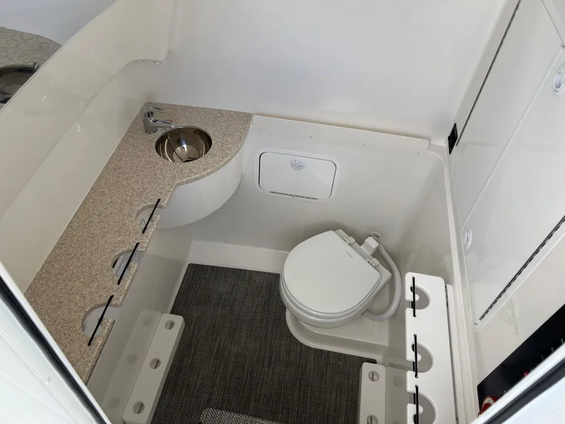Slide: The Image of 2024 Regulator 31 boat interior bathroom with sink and toilet. - 12