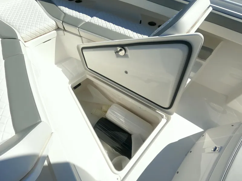 Slide: The Image of 2024 Regulator 31 boat storage compartment with open hatch. - 26