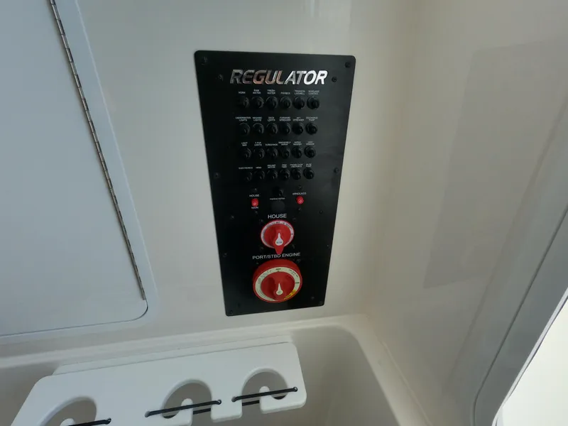 Slide: The Image of Control panel of 2024 Regulator 31 boat with switches and dials. - 30