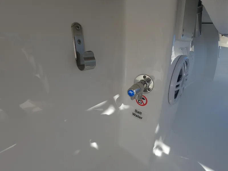 Slide: The Image of 2024 Regulator 31 boat interior with saltwater faucet and speaker. - 35