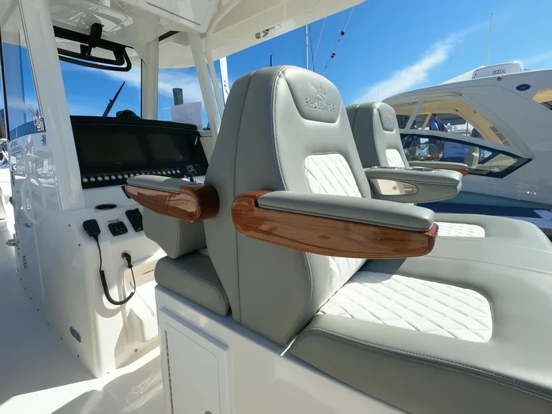 Slide: The Image of 2024 Regulator 31 boat interior with luxurious seating and advanced dashboard. - 37