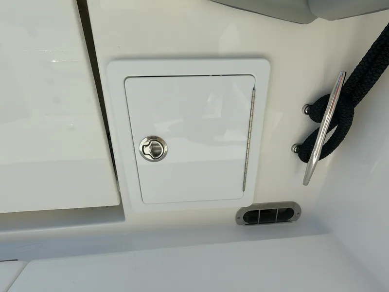 Slide: The Image of 2024 Regulator 31 boat storage compartment and cleat. - 41