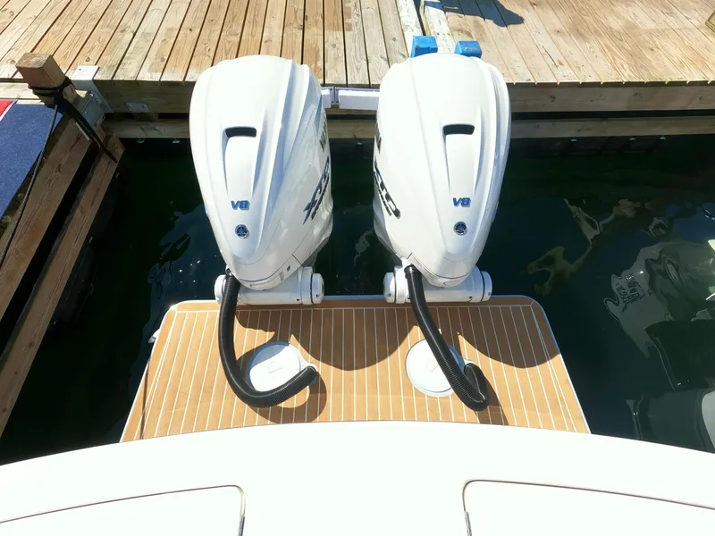 Slide: The Image of 2024 Regulator 31 boat with twin V8 engines docked. - 48