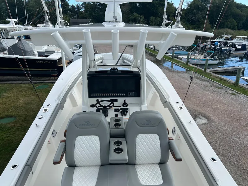 Slide: The Image of 2024 Regulator 31 boat with dual seats and advanced navigation system. - 5