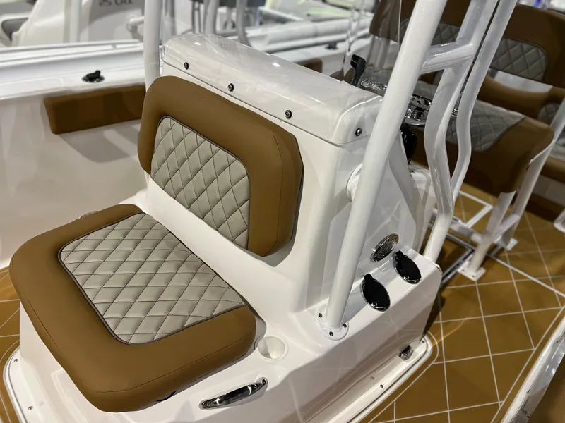 Slide: The Image of 2024 Clearwater 2000 boat with tan and white cushioned seating. - 10