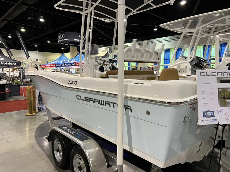 Slide: The Image of 2024 Clearwater 2000 boat on display at an indoor boat show. - 17