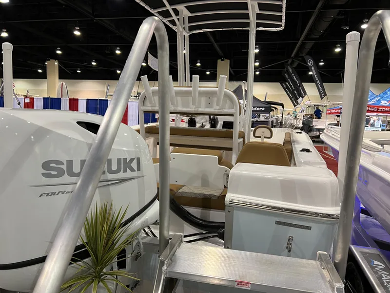 Slide: The Image of 2024 Clearwater 2000 boat with Suzuki engine at indoor boat show. - 19
