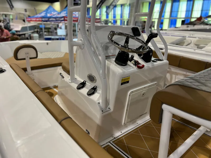 Slide: The Image of 2024 Clearwater 2000 boat interior with steering console and seating. - 4