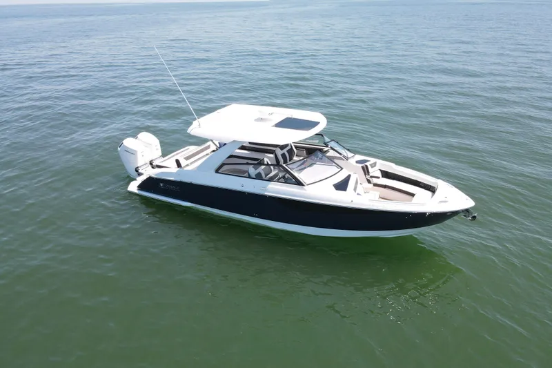 Slide: The Image of 2024 Cobalt R35 Outboard boat on open water. - 1