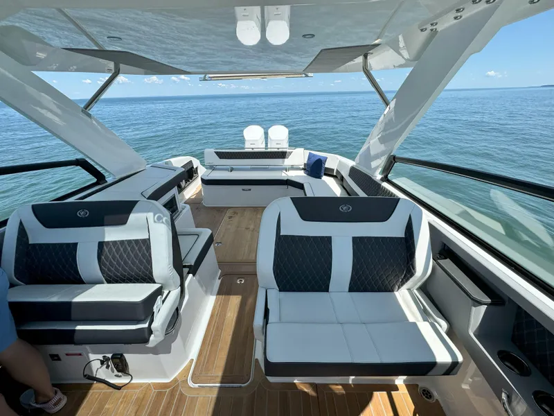 Slide: The Image of 2024 Cobalt R35 Outboard luxury boat interior with spacious seating and ocean view. - 17