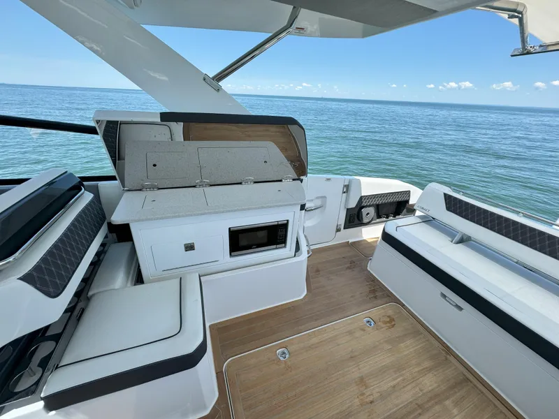 Slide: The Image of 2024 Cobalt R35 Outboard boat interior with seating and ocean view. - 19