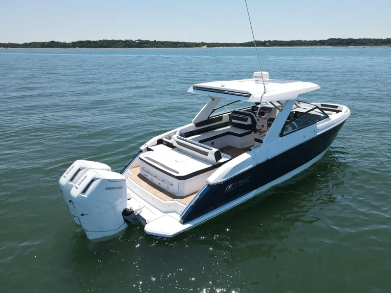 Slide: The Image of 2024 Cobalt R35 Outboard boat on calm water. - 2