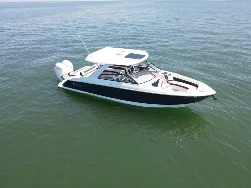 Slide: The Image of 2024 Cobalt R35 Outboard boat on open water. - 3