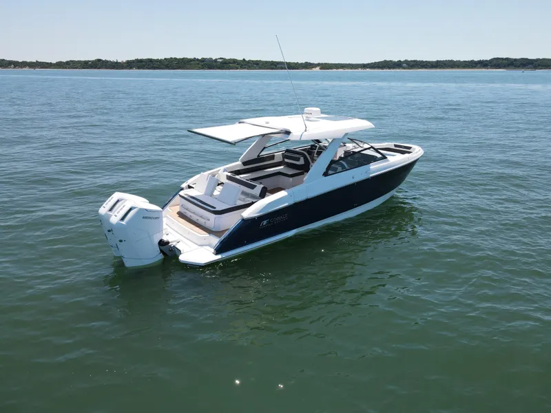 Slide: The Image of 2024 Cobalt R35 Outboard boat on calm water. - 4