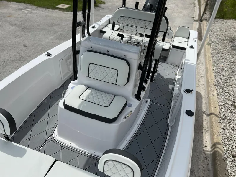 Slide: The Image of 2024 Clearwater 1900 boat interior with cushioned seating and modern design. - 11