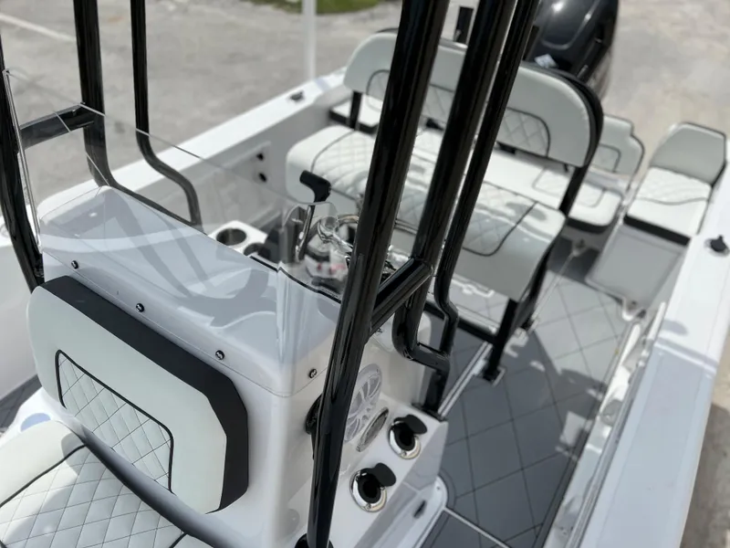 Slide: The Image of 2024 Clearwater 1900 boat interior with seating and console. - 12