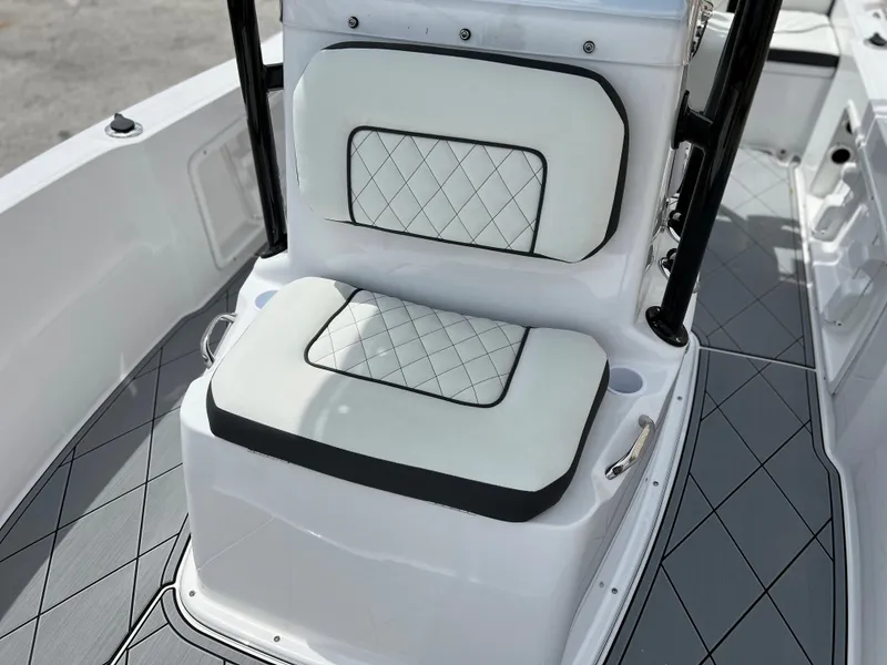 Slide: The Image of 2024 Clearwater 1900 boat with cushioned seating and diamond-patterned upholstery. - 18