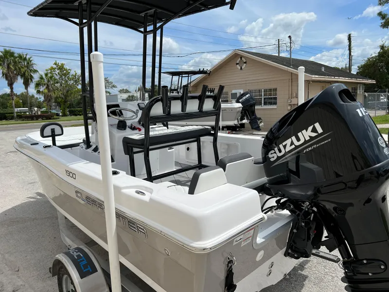 Slide: The Image of 2024 Clearwater 1900 boat with Suzuki outboard motor on trailer. - 20