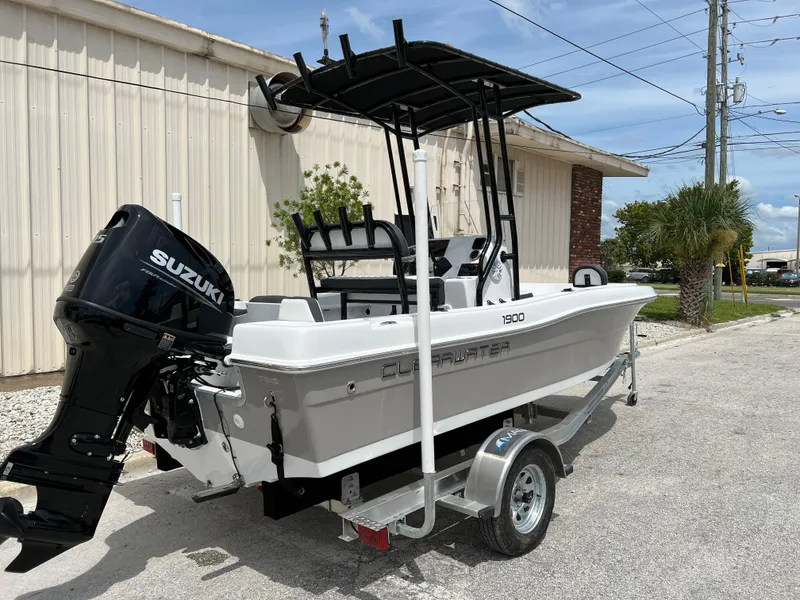 Slide: The Image of 2024 Clearwater 1900 boat with Suzuki outboard motor on trailer. - 22