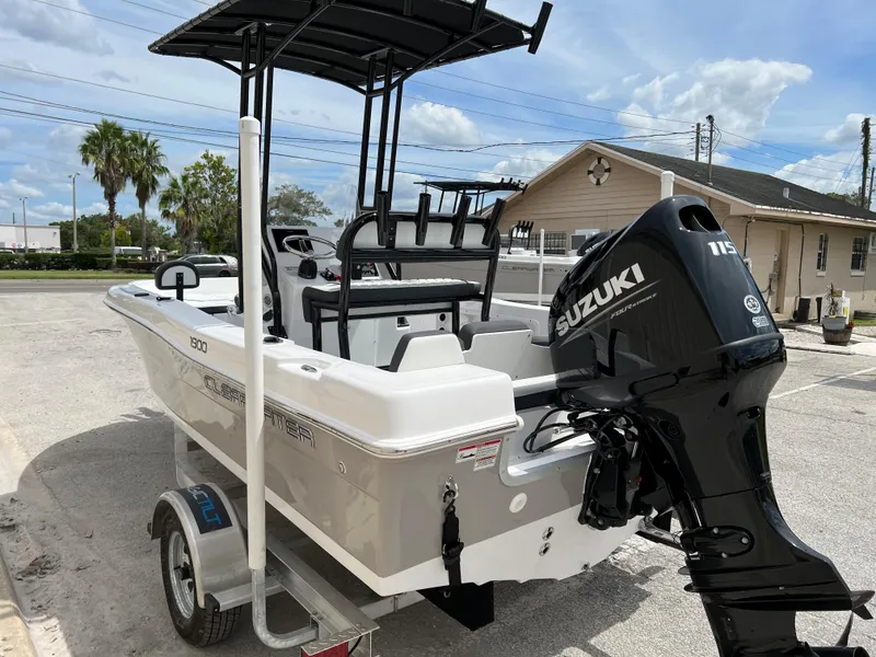 Slide: The Image of 2024 Clearwater 1900 boat with Suzuki 115 outboard motor on trailer. - 23