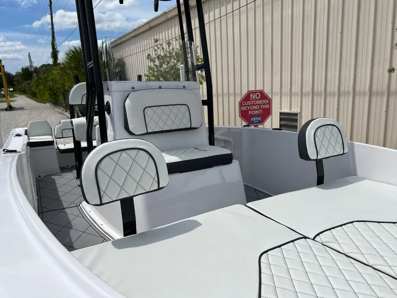 Slide: The Image of 2024 Clearwater 1900 boat interior with white and black diamond-stitched seats. - 3