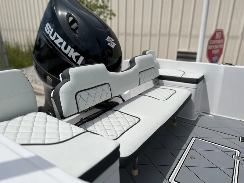 Slide: The Image of Clearwater 1900 boat 2024 model with Suzuki outboard motor and cushioned seating. - 4