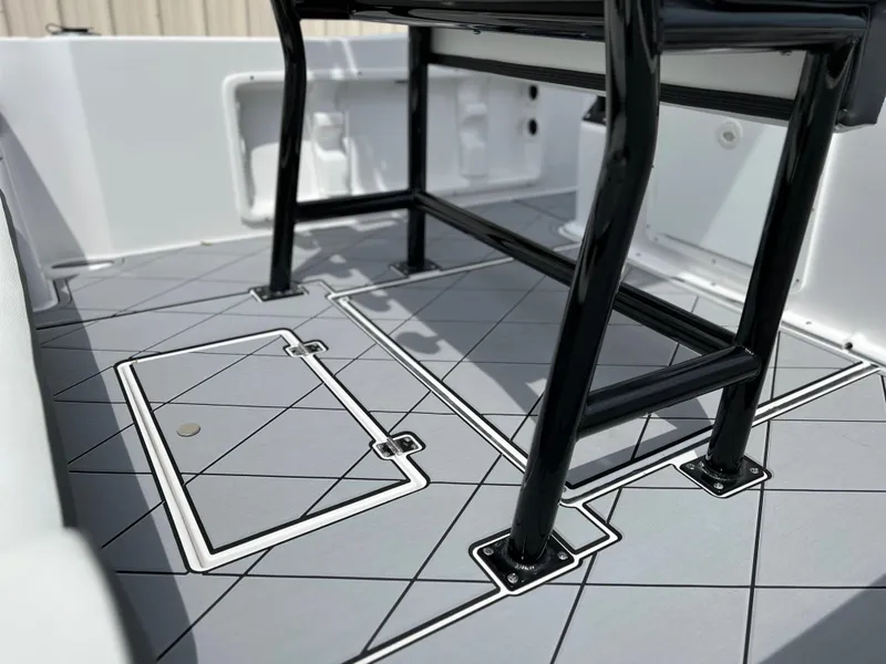 Slide: The Image of 2024 Clearwater 1900 boat deck with storage compartments and black frame. - 6