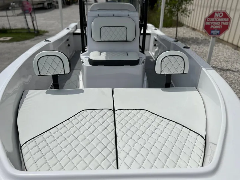 Slide: The Image of 2024 Clearwater 1900 boat interior with white diamond-stitched seats and cushions. - 9