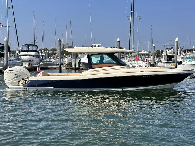 The Image of 2021 Chris-Craft Calypso 35 boat docked in a marina. - 0