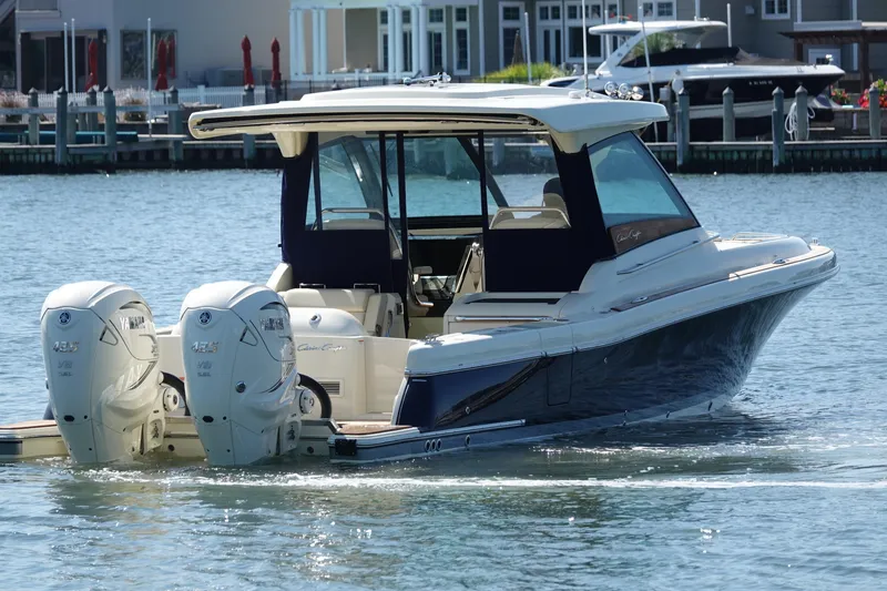 Slide: The Image of 2021 Chris-Craft Calypso 35 boat with twin Yamaha engines on the water. - 10