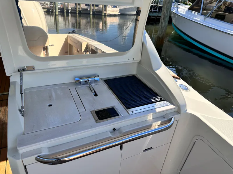 Slide: The Image of 2021 Chris-Craft Calypso 35 boat kitchenette with sink and grill. - 12