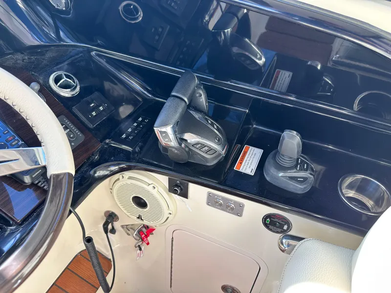 Slide: The Image of 2021 Chris-Craft Calypso 35 helm controls and dashboard. - 17
