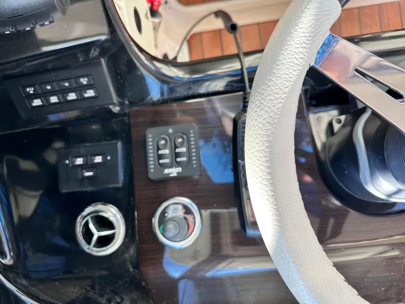 Slide: The Image of 2021 Chris-Craft Calypso 35 helm controls and steering wheel. - 19