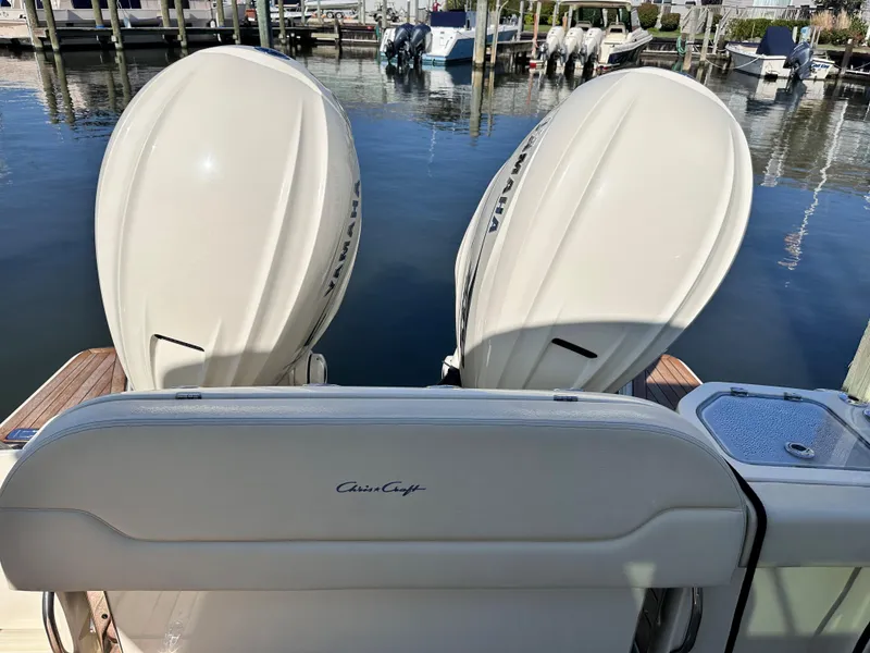 Slide: The Image of 2021 Chris-Craft Calypso 35 boat with twin outboard engines docked at marina. - 22