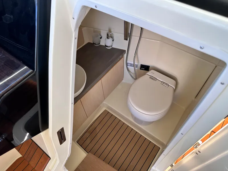 Slide: The Image of 2021 Chris-Craft Calypso 35 boat bathroom with modern fixtures and wooden flooring. - 23