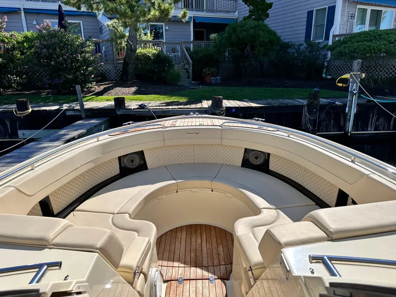 Slide: The Image of 2021 Chris-Craft Calypso 35 boat with spacious seating and wooden deck. - 24