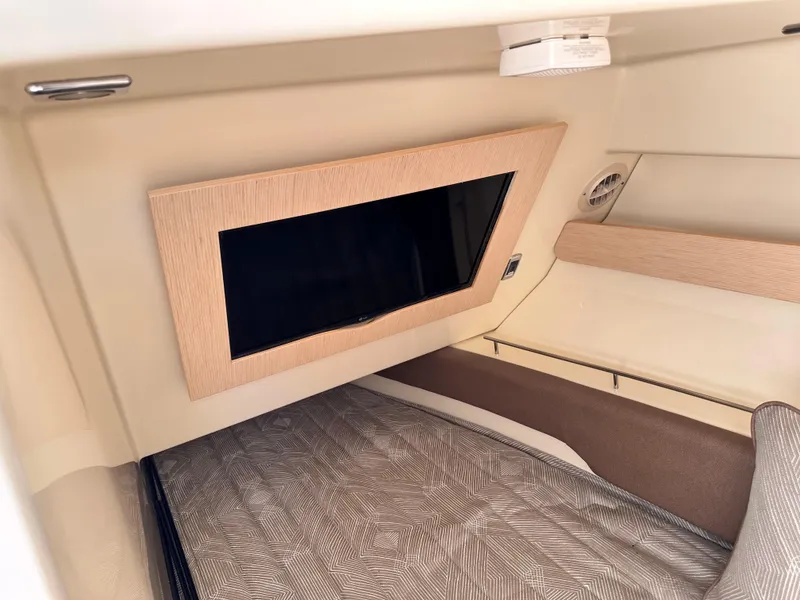Slide: The Image of Interior cabin of 2021 Chris-Craft Calypso 35 with TV and bed. - 28