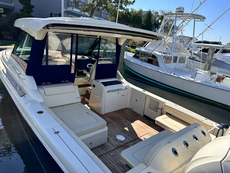 Slide: The Image of 2021 Chris-Craft Calypso 35 boat with spacious seating and modern amenities. - 29