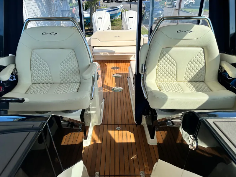 Slide: The Image of 2021 Chris-Craft Calypso 35 interior with luxurious seating and teak flooring. - 41
